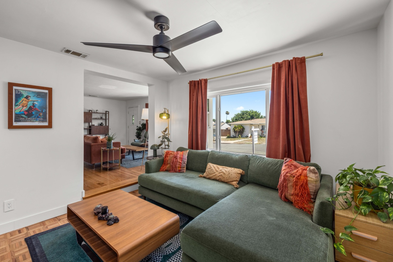 The living room with the terracotta curtains