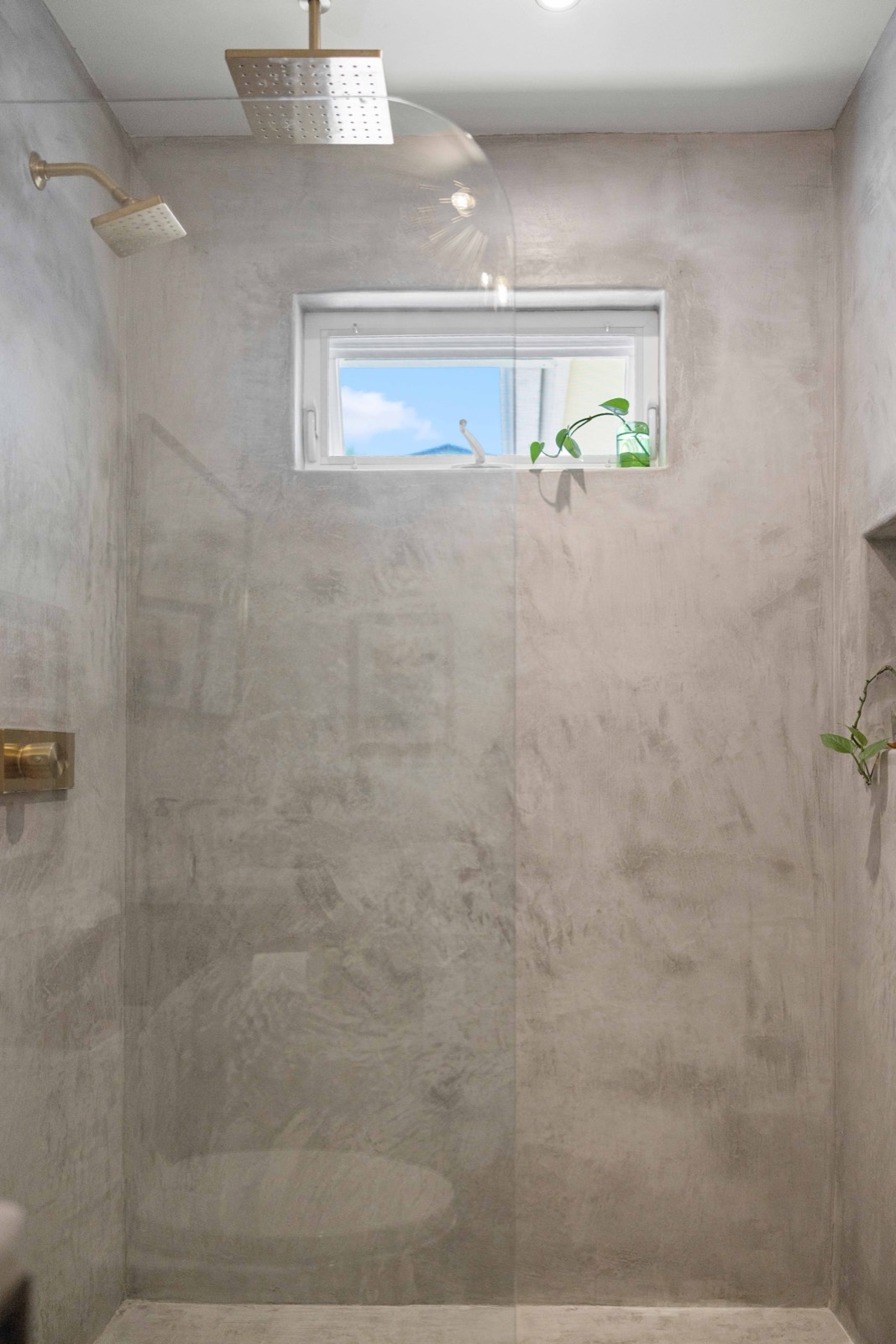 The walk-in concrete shower