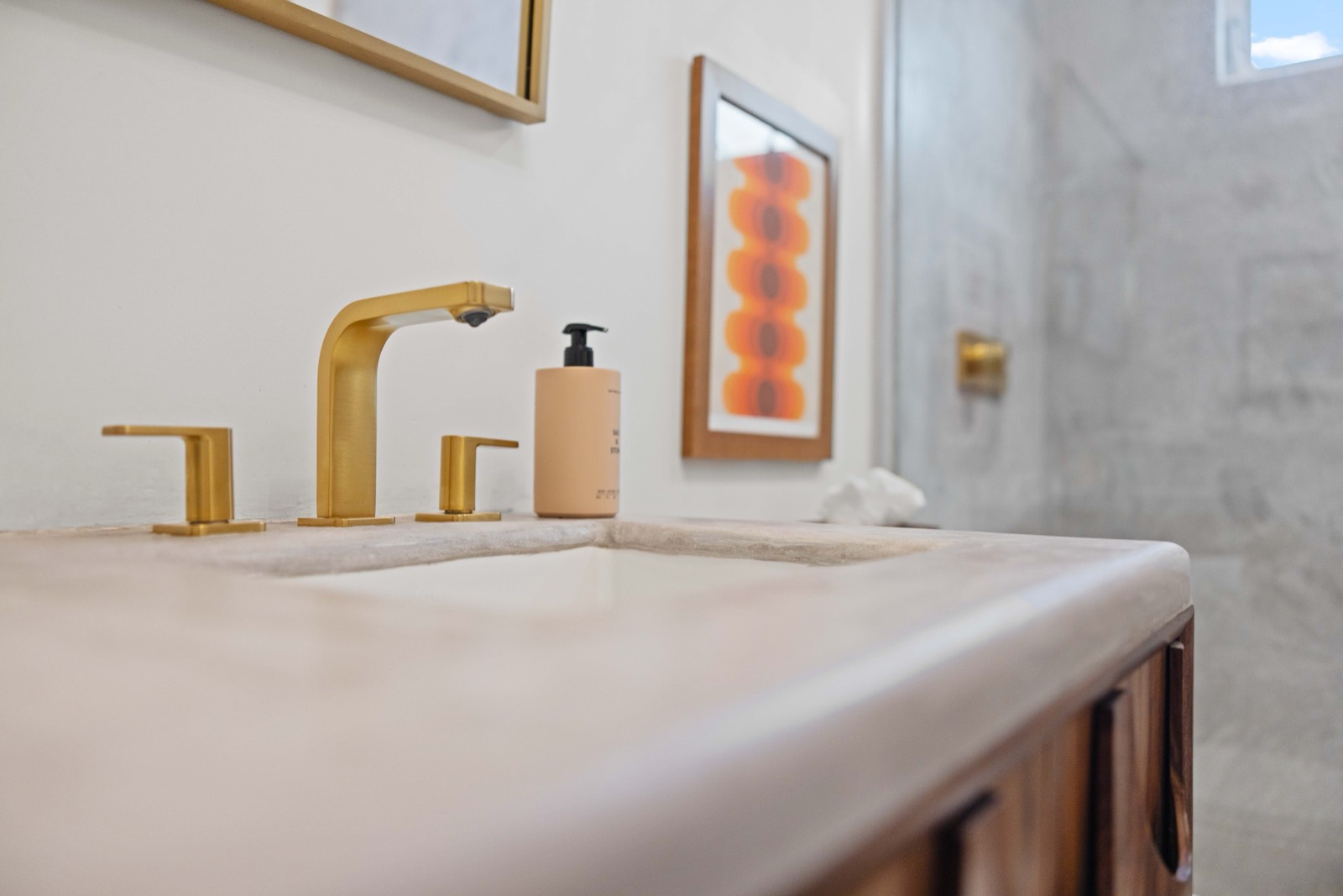 Brass fixtures on a concrete counter