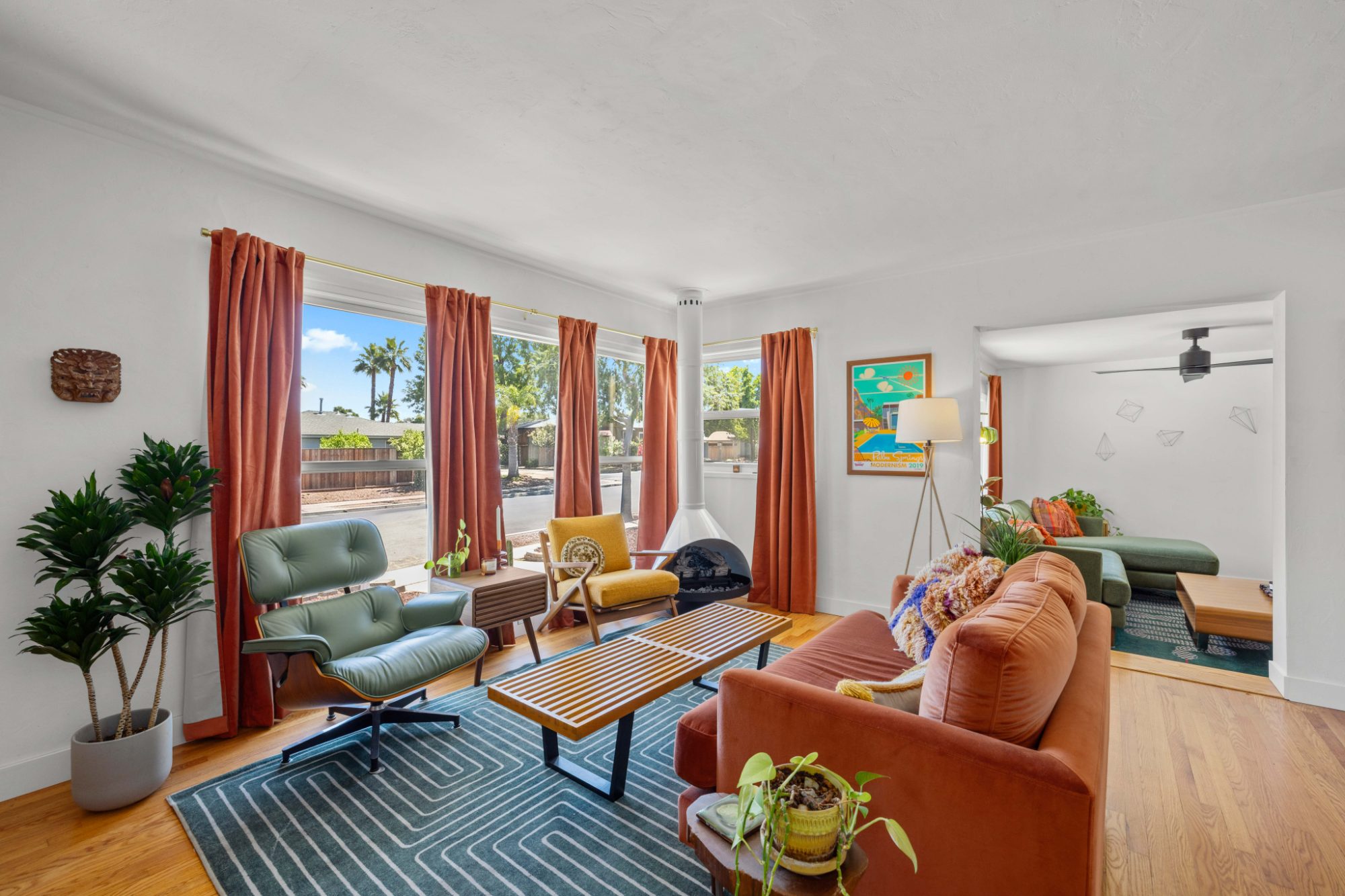 The living room and its floor-to-ceiling windows